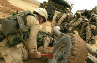 Sgt. Shane Glowcheski, gunner, Battery B, 2nd Bn. 319th AFAR and his Howitzer crew prepare their gun to be fired. The artillerymen practice emplacing their weapon within six minutes and function as a coordinated team. PHOTO BY: Spc. Jason B. Baker, 49th Public Affairs Detachment (Airborne).